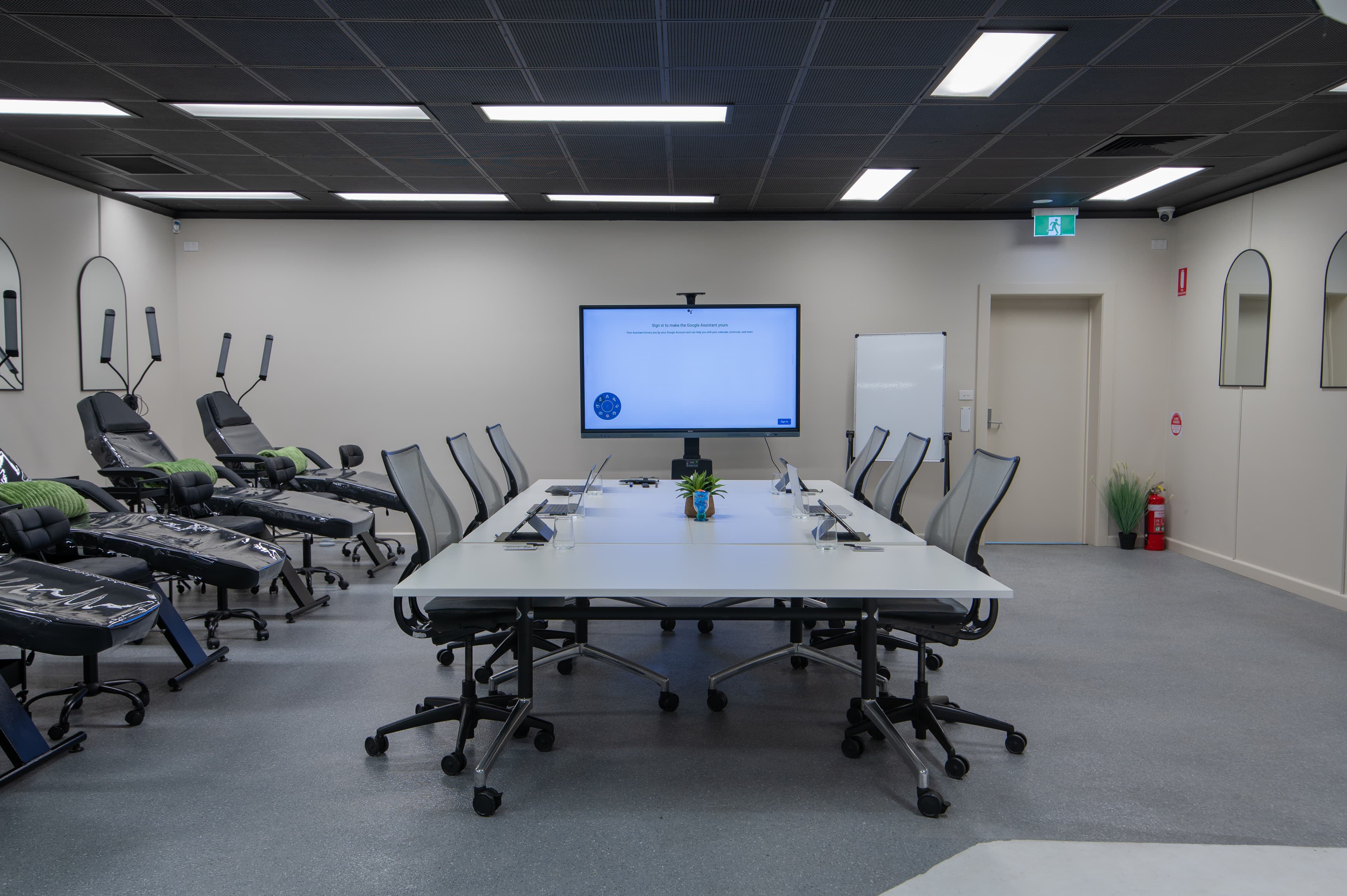 Education studio with treatment stations, training table and large digital screen